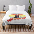 A soft, plush blanket featuring a vintage sun motif design