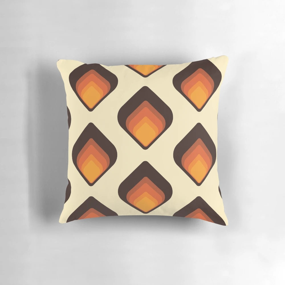 Colorful mid-century modern tear drop shaped pillow in shades of orange and brown