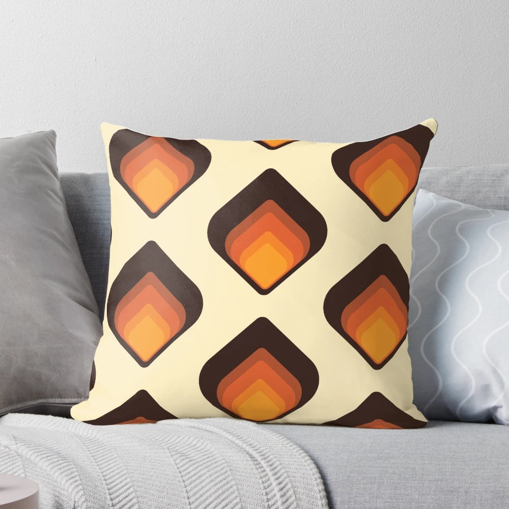 Colorful mid-century modern tear drop shaped pillow in shades of orange and brown