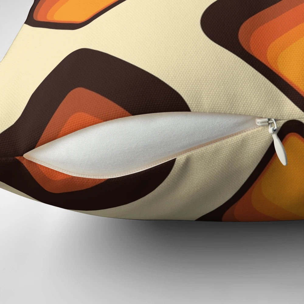 Colorful mid-century modern tear drop shaped pillow in shades of orange and brown