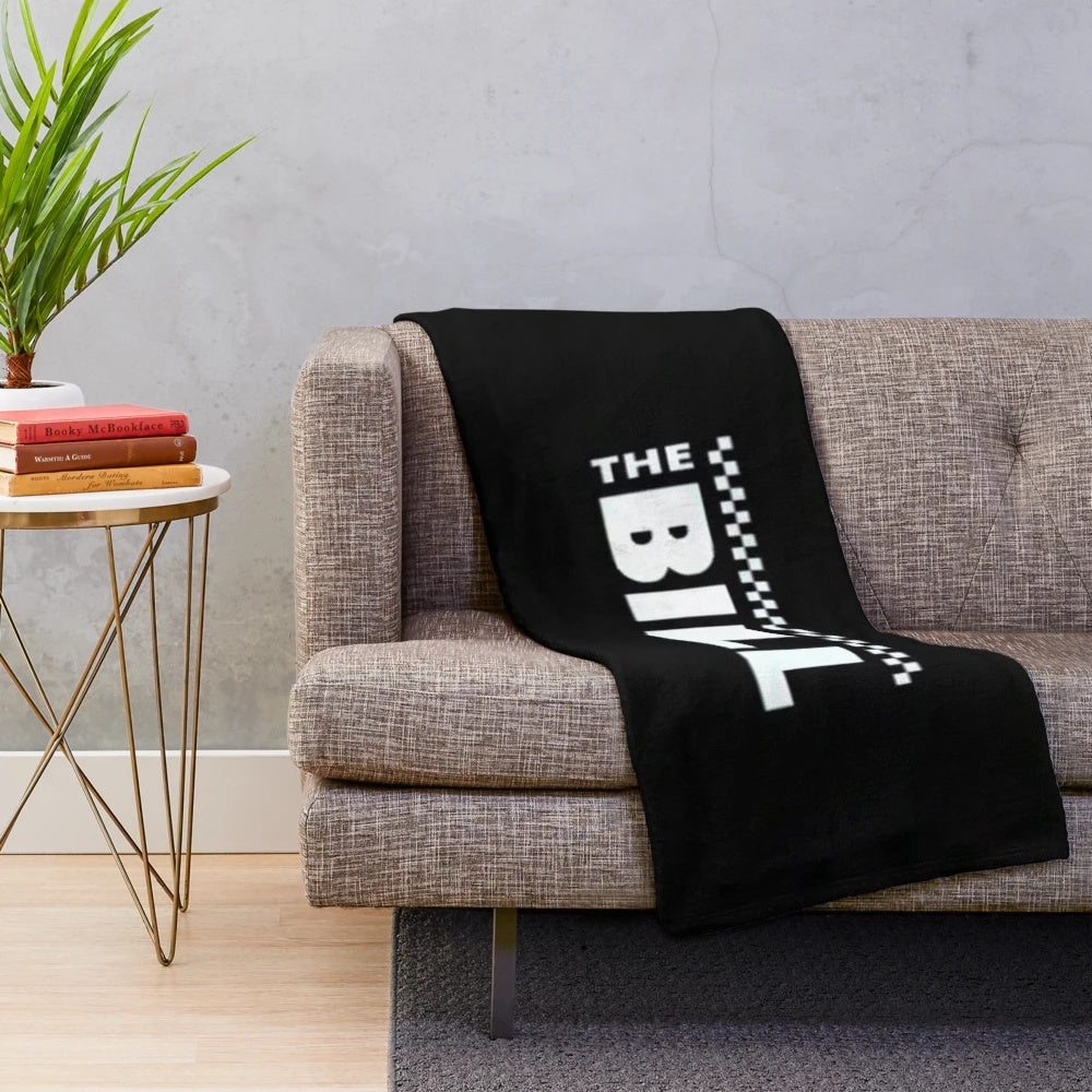 Soft and cozy plush blanket featuring the iconic logo from the British TV series "The Bill