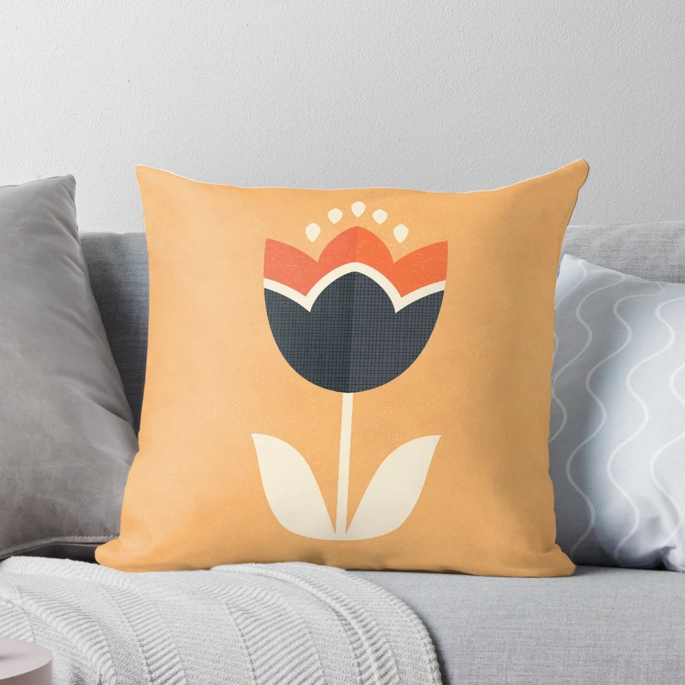 Retro tulip patterned throw pillow in orange and cream colors