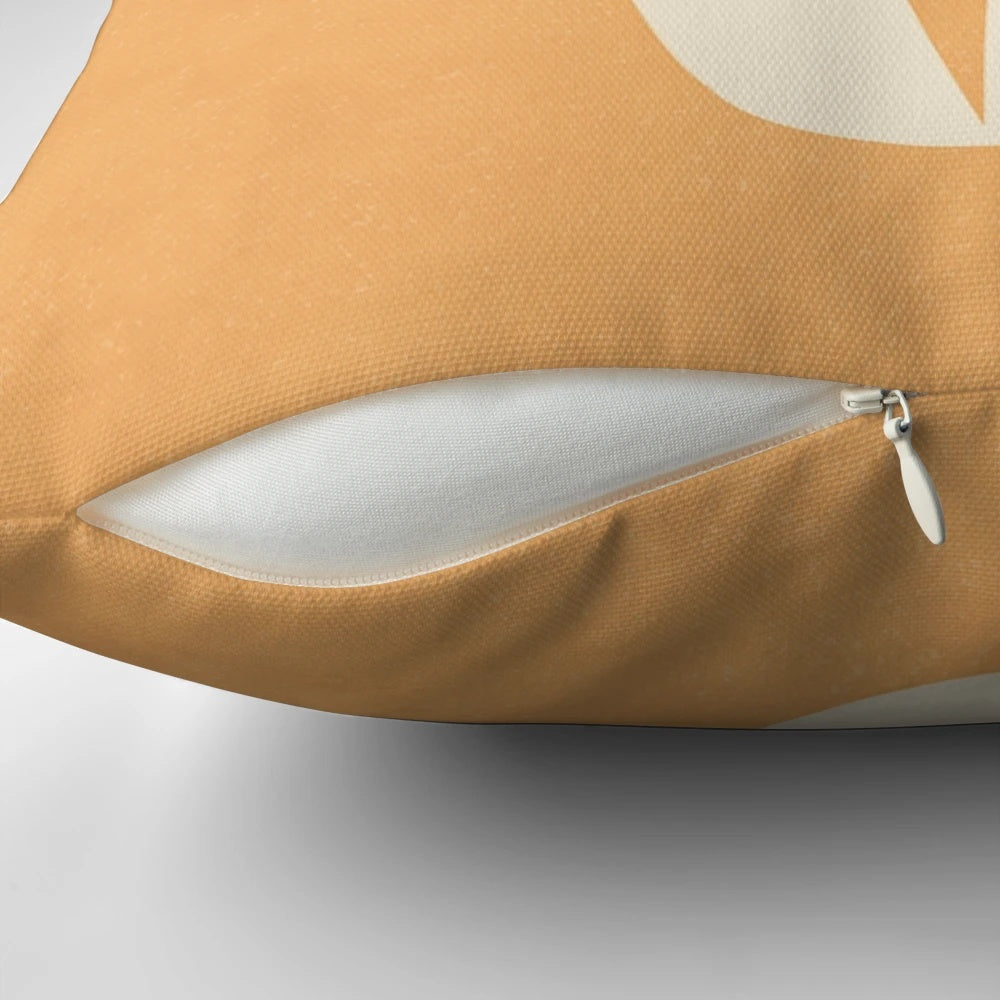 Retro tulip patterned throw pillow in orange and cream colors