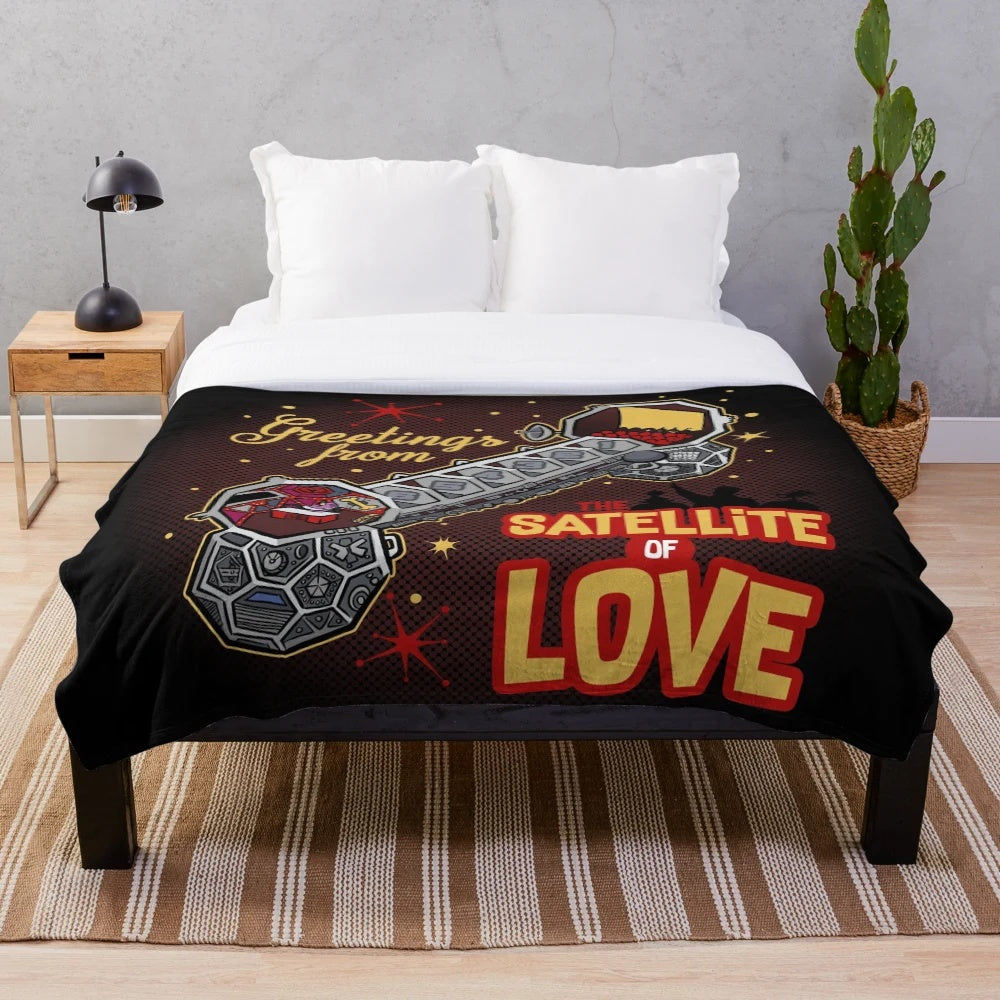 Cozy MST3K-inspired plush blanket featuring the Satellite of Love