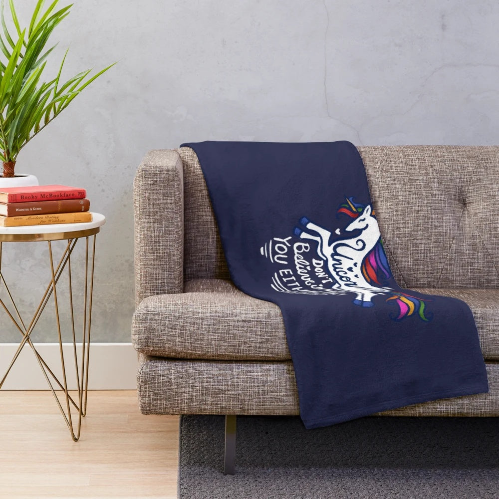 Retro unicorn plush blanket with "Unicorns Don't Believe In You" text