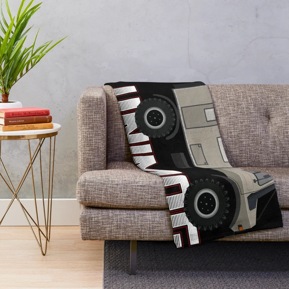 Retro Unimog-inspired plush blanket with a cool, graphic design