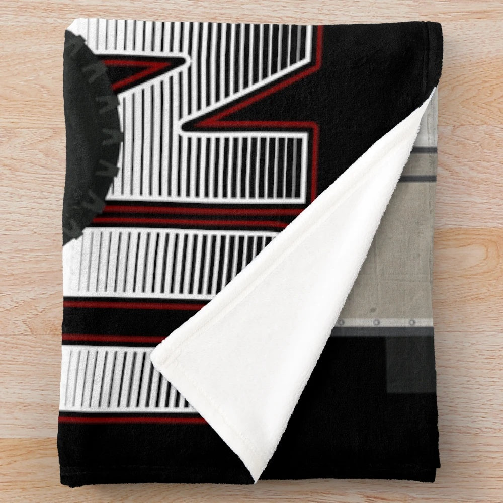 Retro Unimog-inspired plush blanket with a cool, graphic design