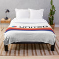 Plush blanket featuring the iconic Saul Bass-designed United Airlines livery