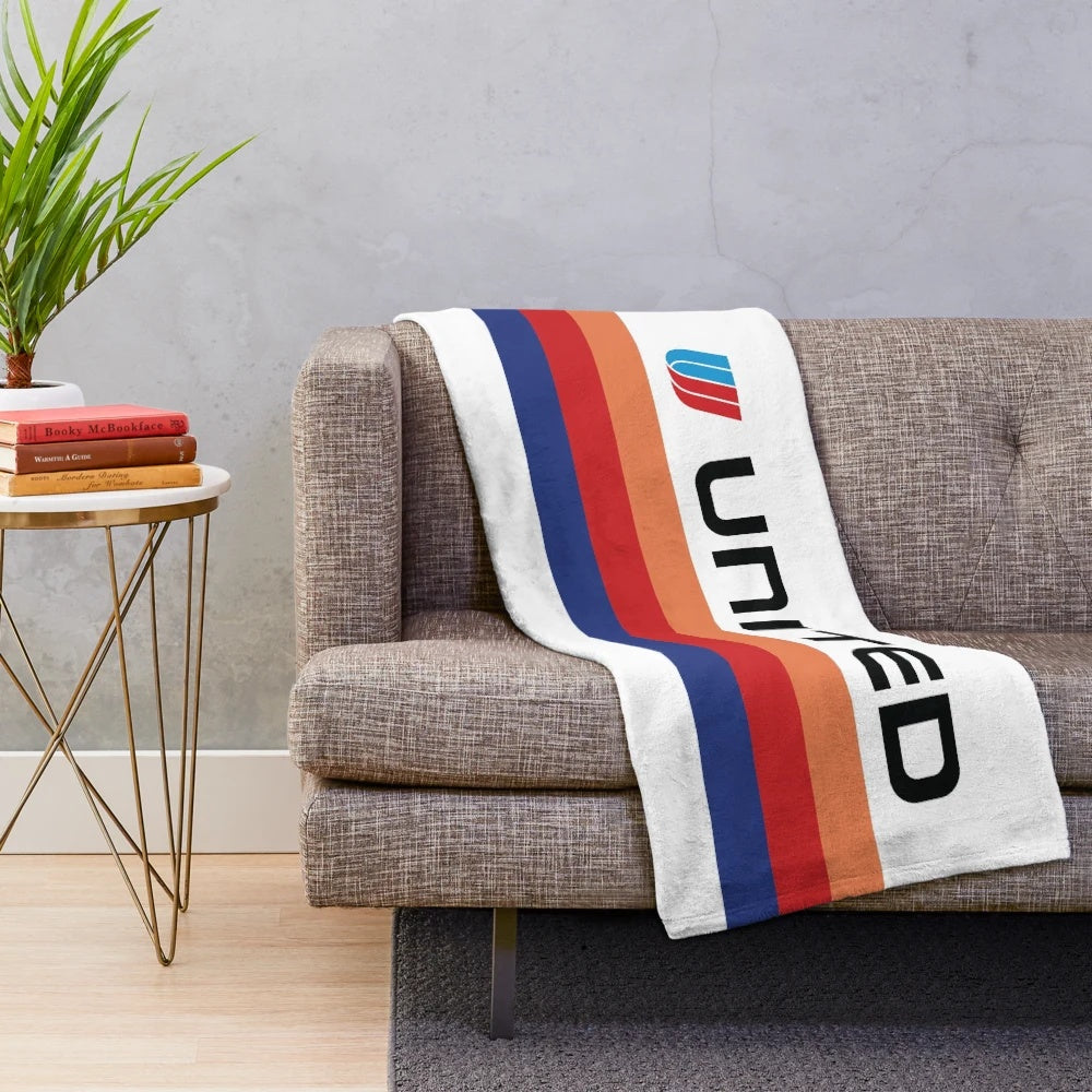 Plush blanket featuring the iconic Saul Bass-designed United Airlines livery