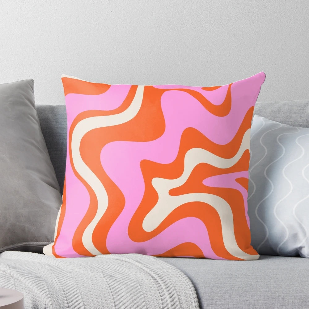 Retro vibrant liquid swirl abstract pattern throw pillow in pink, orange, and cream colors