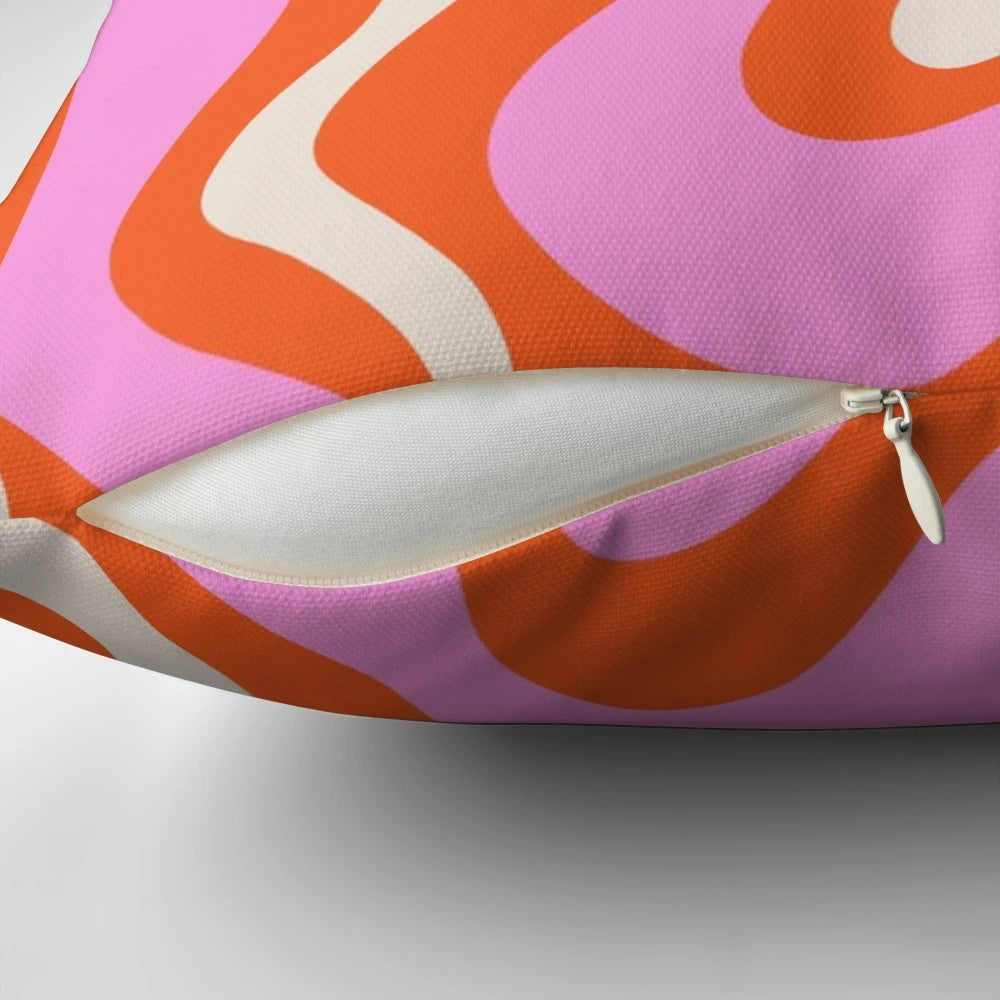 Retro vibrant liquid swirl abstract pattern throw pillow in pink, orange, and cream colors