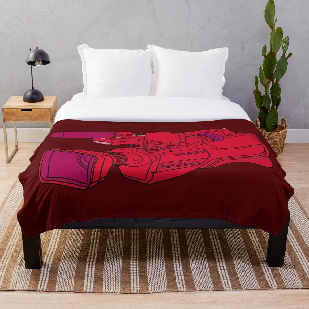 Cozy red plush blanket with a retro video camera design