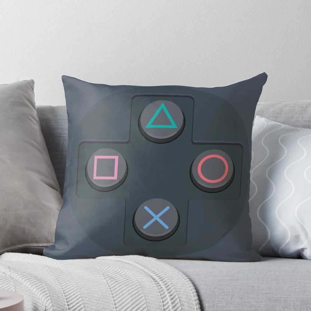 Retro video game controller buttons printed on a soft, plush pillow