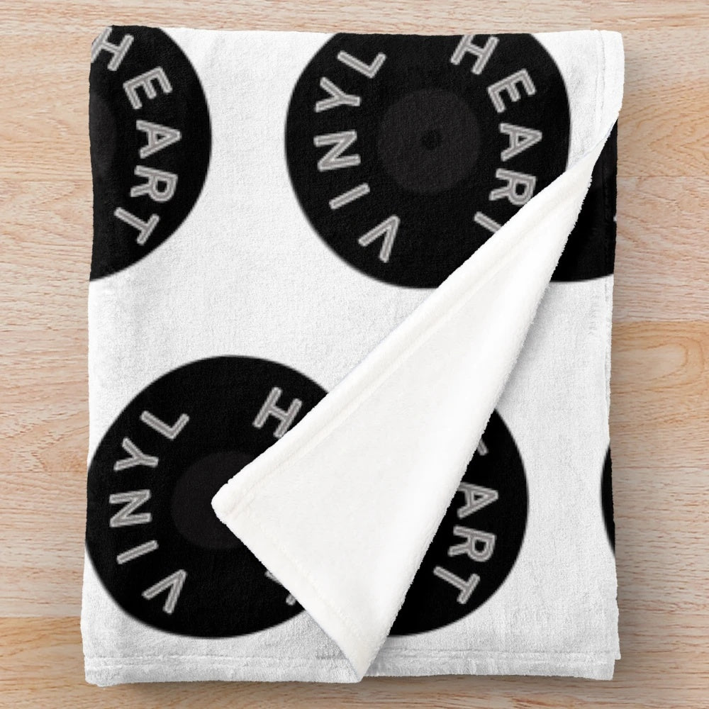 Cozy plush blanket with a vinyl record design for music lovers