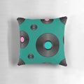 Colorful retro-style pillow featuring a vibrant pattern of vinyl records in pink, teal, and purple hues