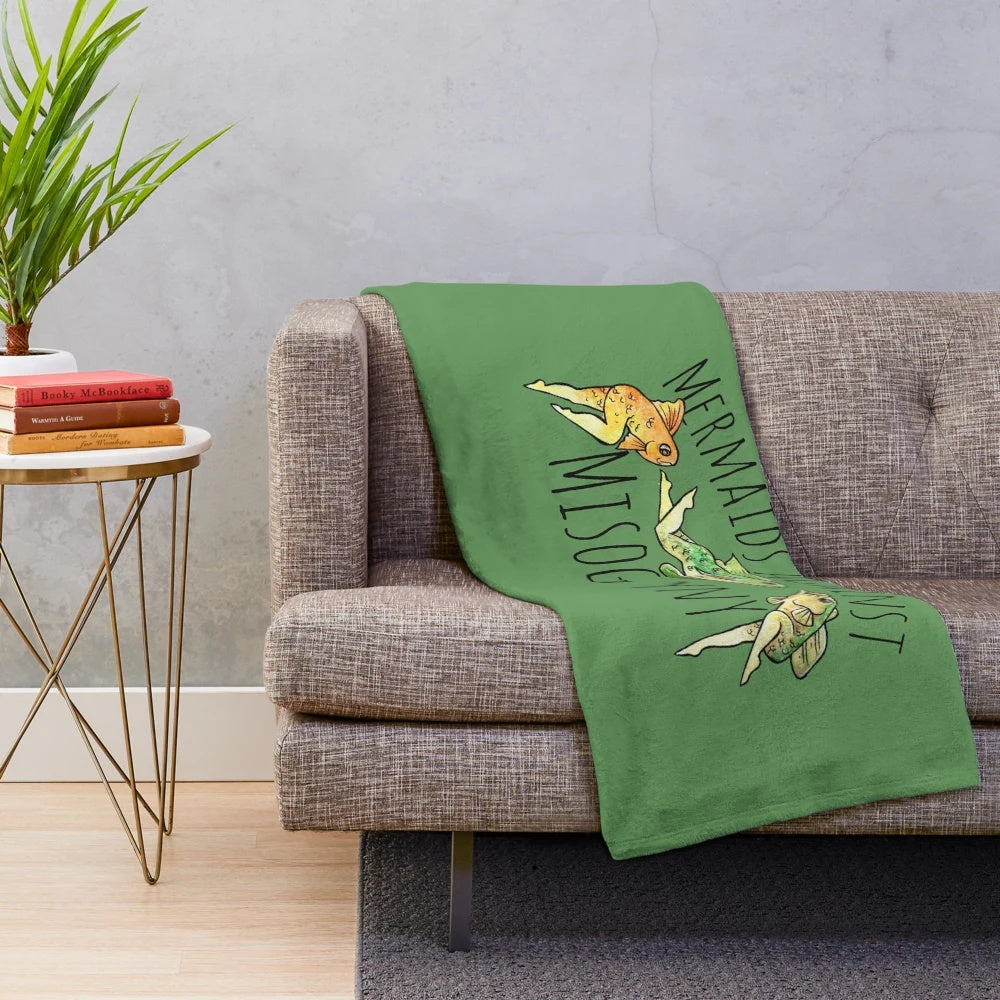 Reverse mermaid plush blanket with text "Mermaids Against Misogyny