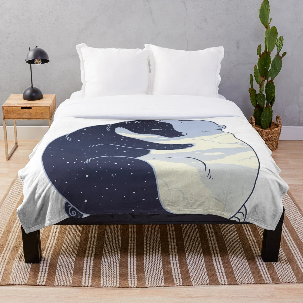 Cozy plush blanket with a day and night design featuring clouds, stars, and a huggable bear