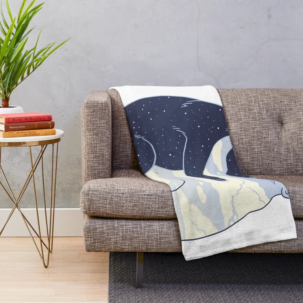 Cozy plush blanket with a day and night design featuring clouds, stars, and a huggable bear