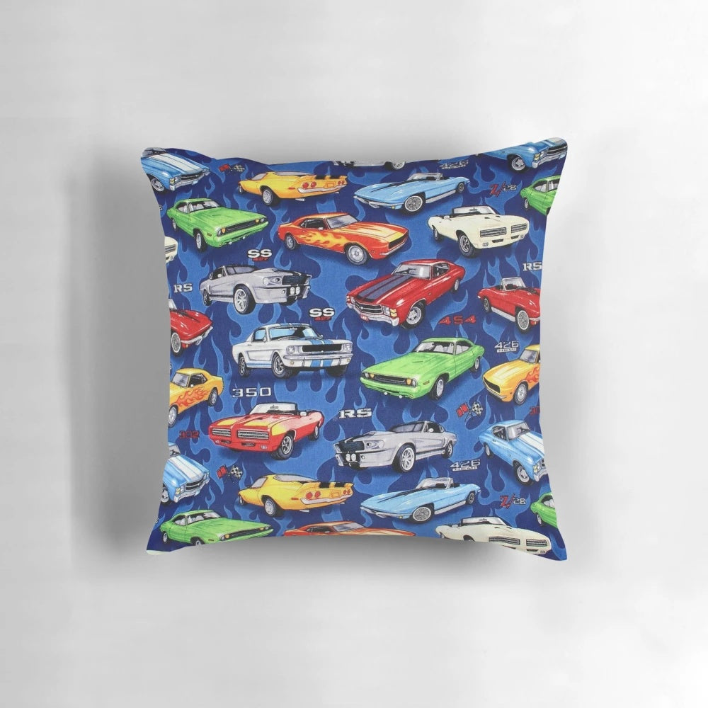 Colorful pattern pillow featuring vintage and classic muscle cars in shades of blue