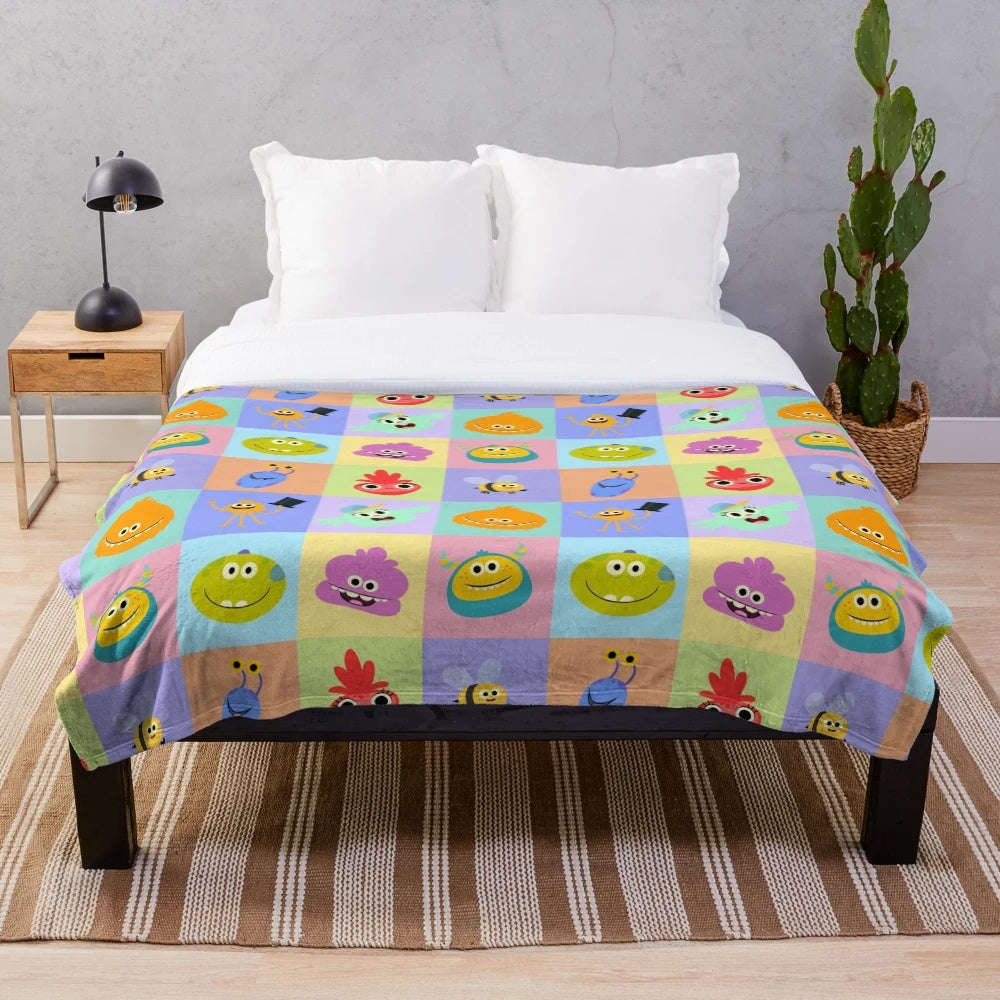 Rhymington Square inspired plush blanket with colorful patterns