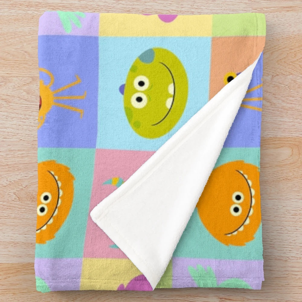 Rhymington Square inspired plush blanket with colorful patterns