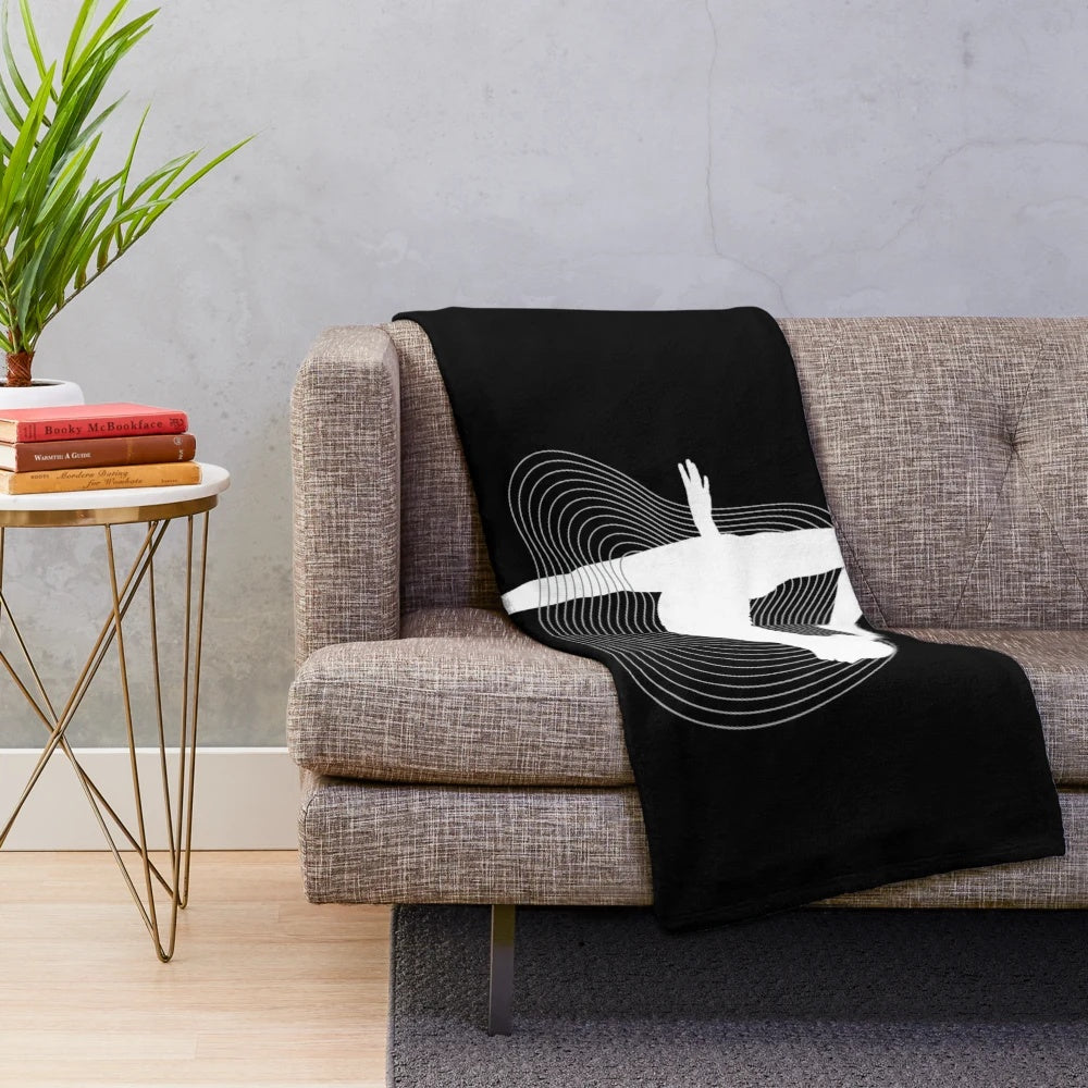 Rhythmic gymnastics penche pose silhouette on white plush blanket
