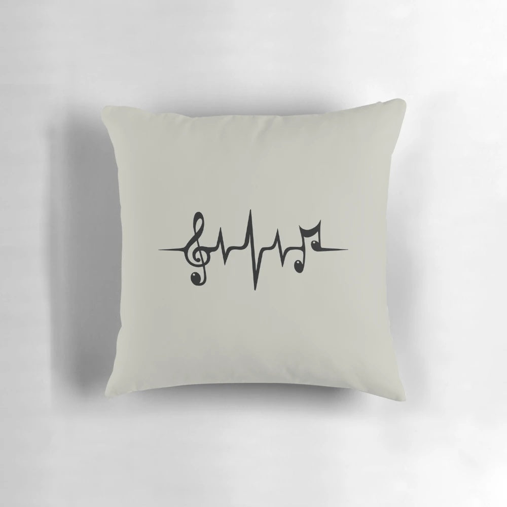 A cozy music-themed pillow featuring a heart-shaped waveform design and musical symbols
