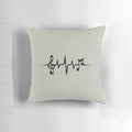 A cozy music-themed pillow featuring a heart-shaped waveform design and musical symbols
