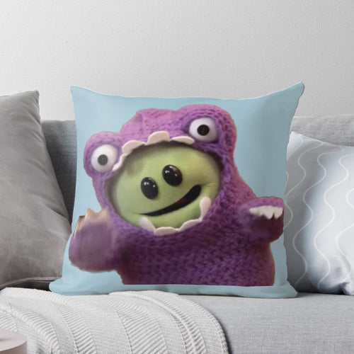 "A cozy pillow featuring a roaring monster, perfect for Nanalan meme and TikTok enthusiasts"