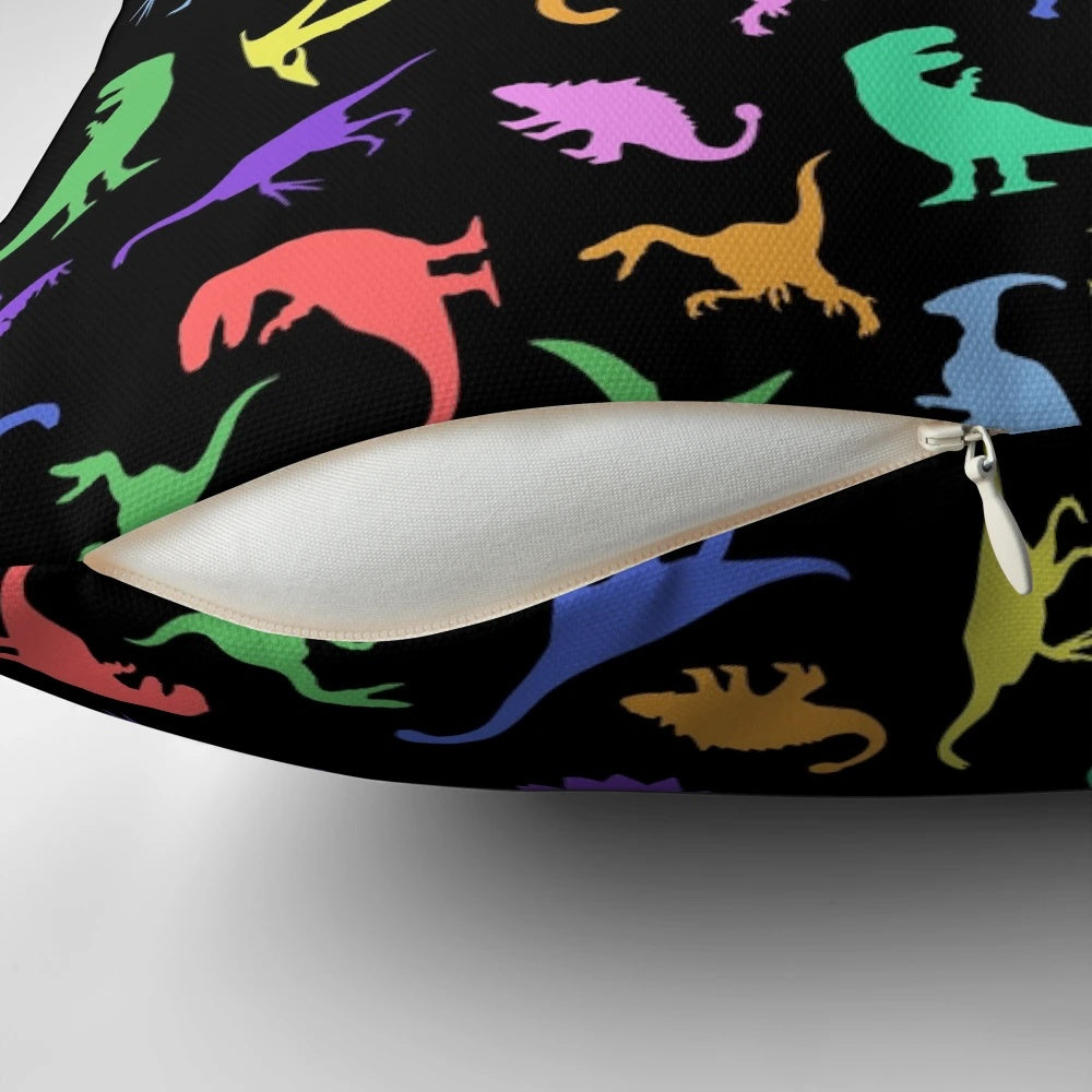 A black and white dinosaur-patterned pillow featuring various prehistoric creatures like T-Rex and Pterodactyl.