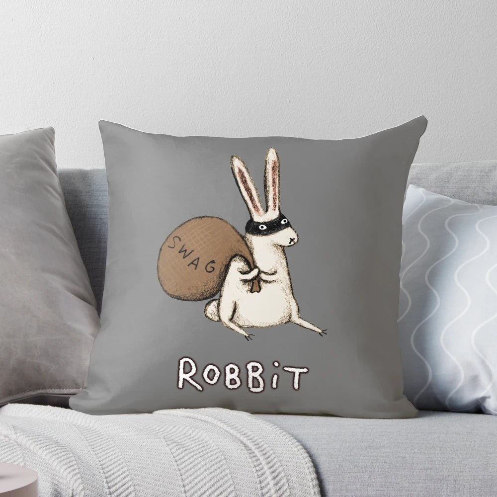 A plush robbit or rabbit-themed animal figurine with a cheeky expression, perfect for home decor.