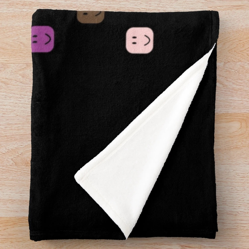 Roblox-inspired plush blanket featuring a smiling noob face