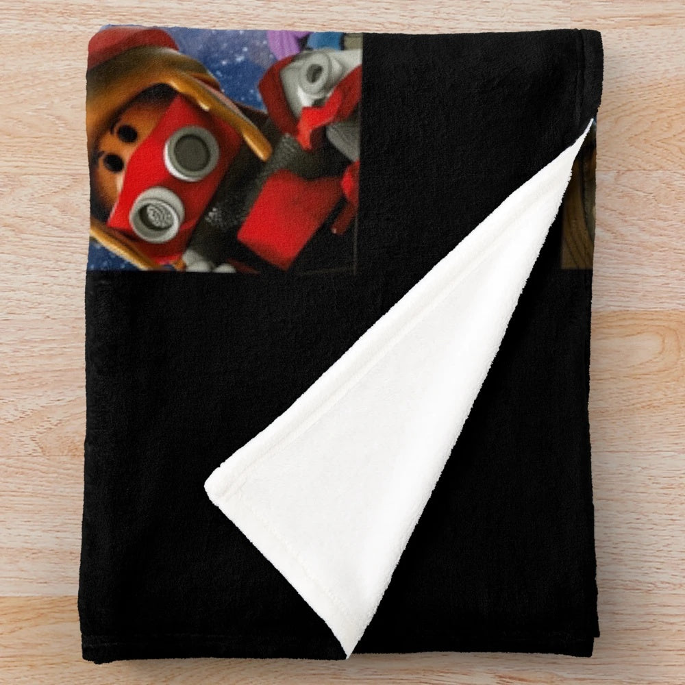 A soft and plush blanket featuring the Roblox logo and game elements