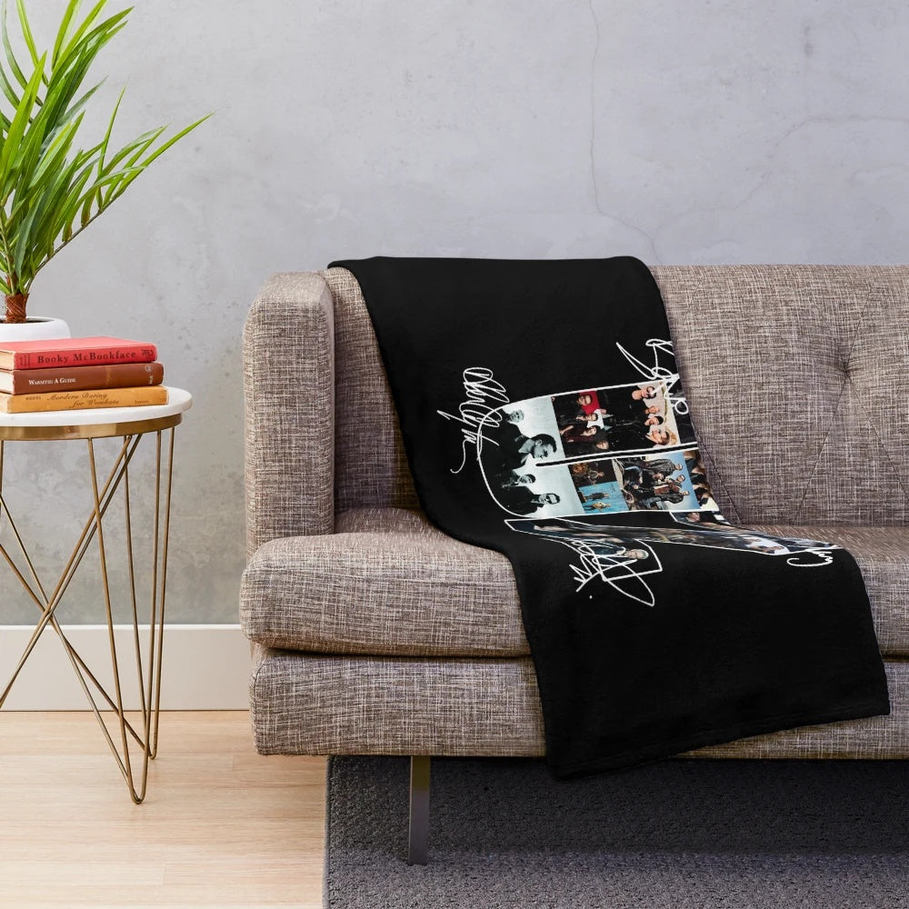 Rock band signatures printed on a soft, cozy plush blanket