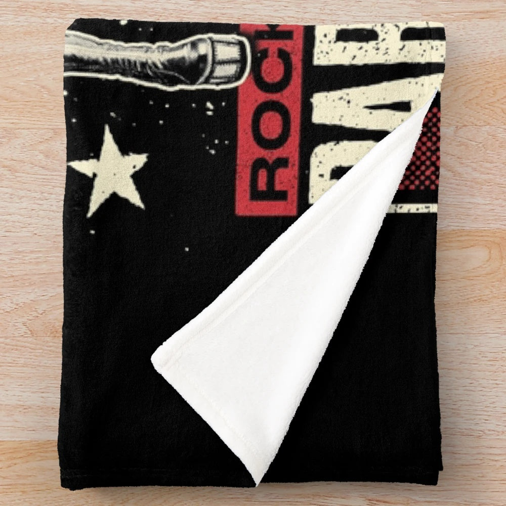 KISS-inspired plush blanket with the band's logo and text