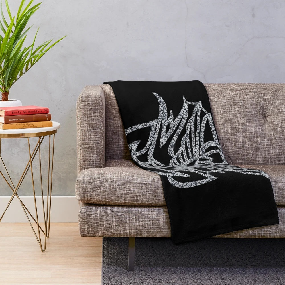 Plush blanket featuring a guitar design