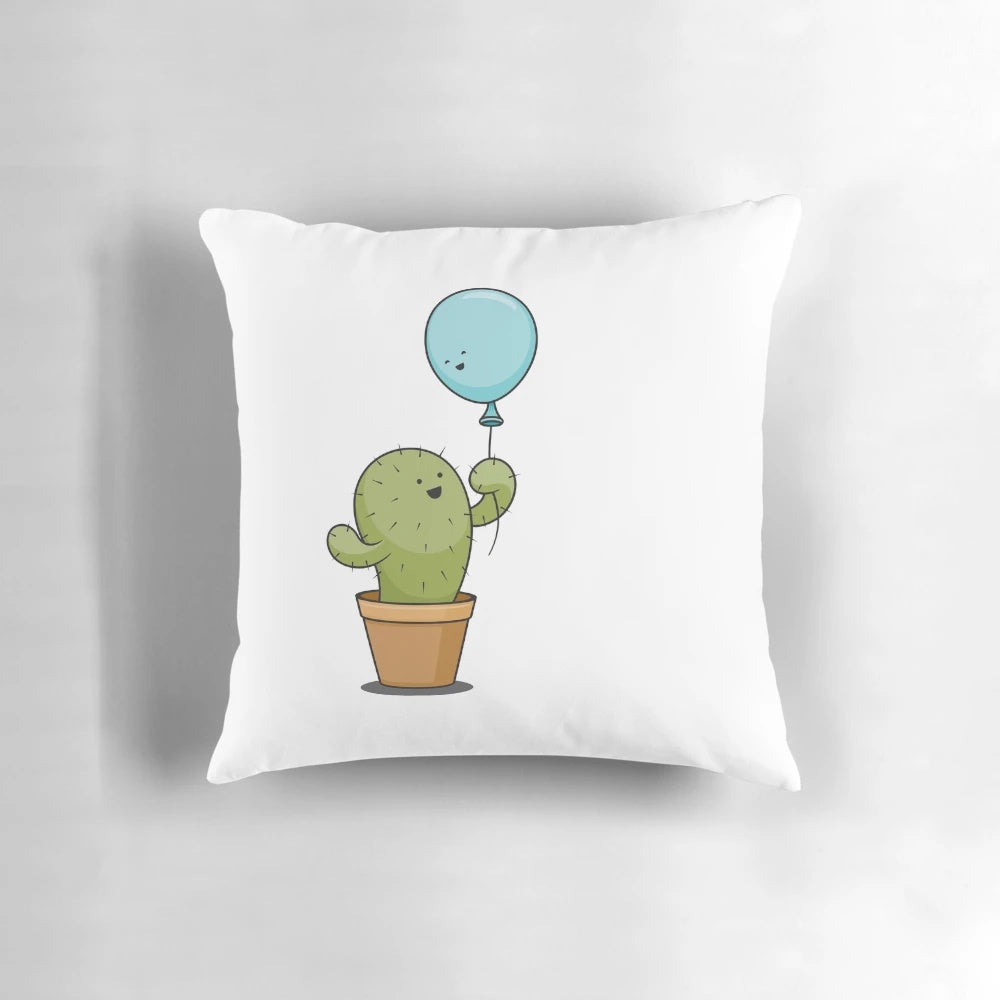 Whimsical pillow featuring a cactus and balloon in a loving embrace, representing true love and soulmates.