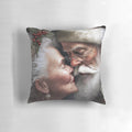 Mr. and Mrs. Santa Claus Christmas pillow with the couple kissing under mistletoe