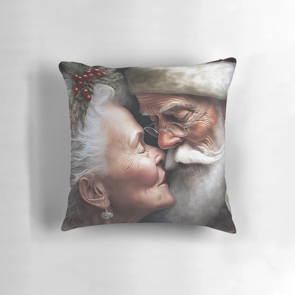 Mr. and Mrs. Santa Claus Christmas pillow with the couple kissing under mistletoe