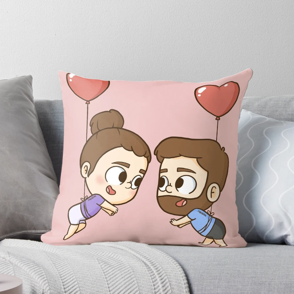 Romantic decorative pillow featuring a couple and heart shaped balloons