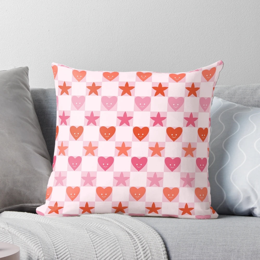 A soft, pink and red heart-shaped pillow with a checkerboard pattern, perfect for Valentine's Day, anniversaries, and cottage core home decor.