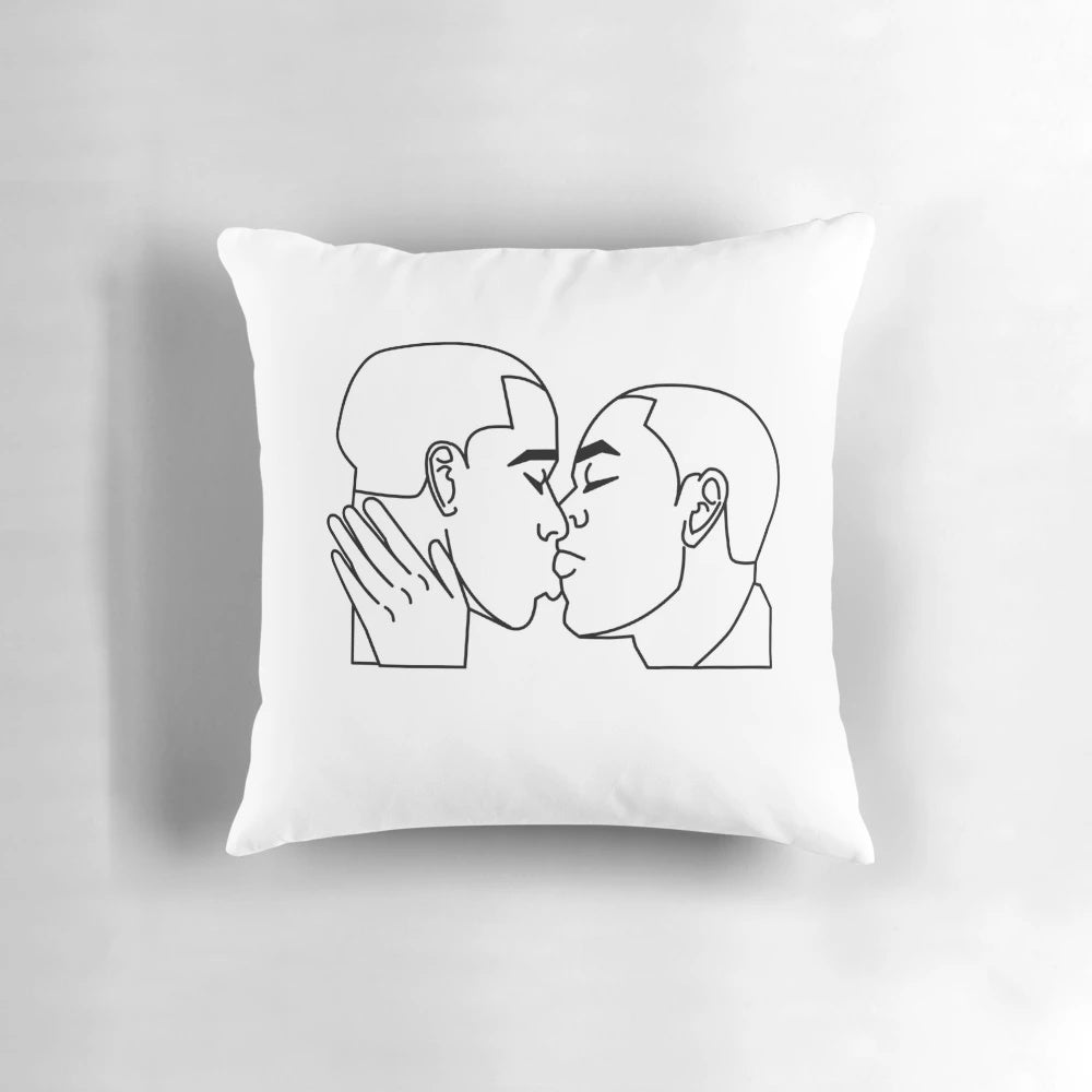 A soft, plush pillow featuring an image of two men kissing, designed for LGBTQ+ home decor.