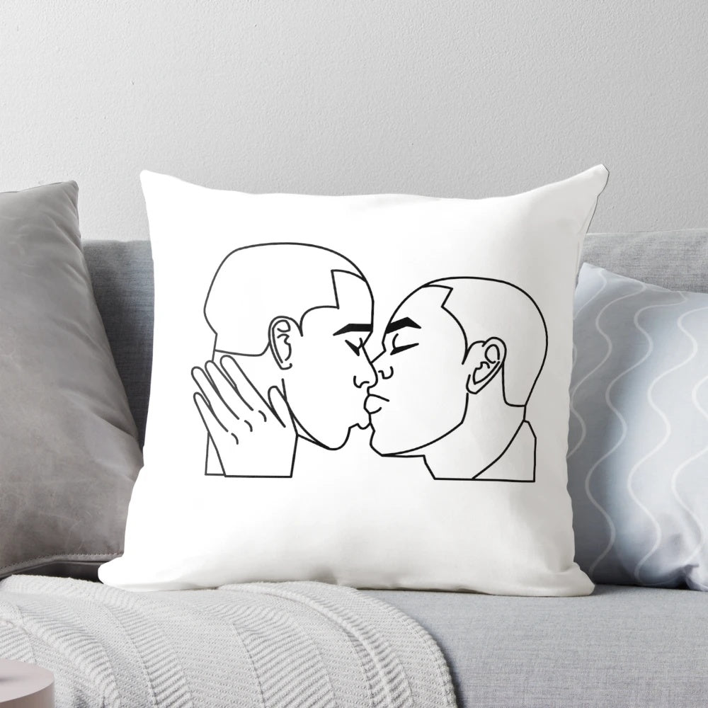 A soft, plush pillow featuring an image of two men kissing, designed for LGBTQ+ home decor.