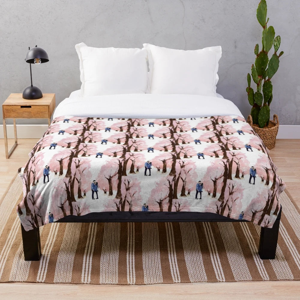 Soft and cozy plush blanket featuring a romantic sakura (cherry blossom) design