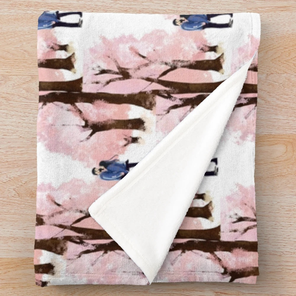 Soft and cozy plush blanket featuring a romantic sakura (cherry blossom) design