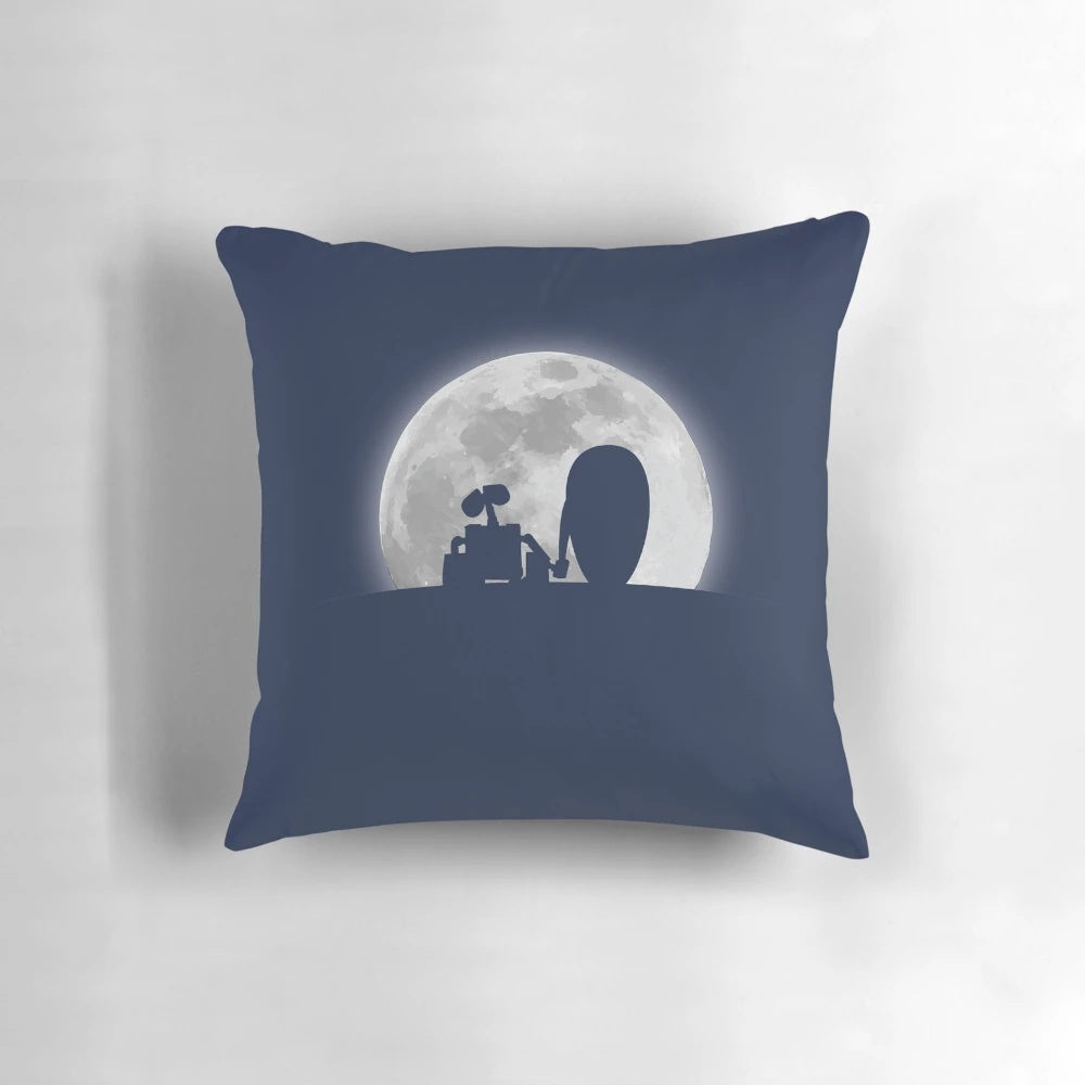 A decorative pillow featuring the silhouettes of the characters Wall•E and EVE from the Pixar film, set against a moonlit backdrop.