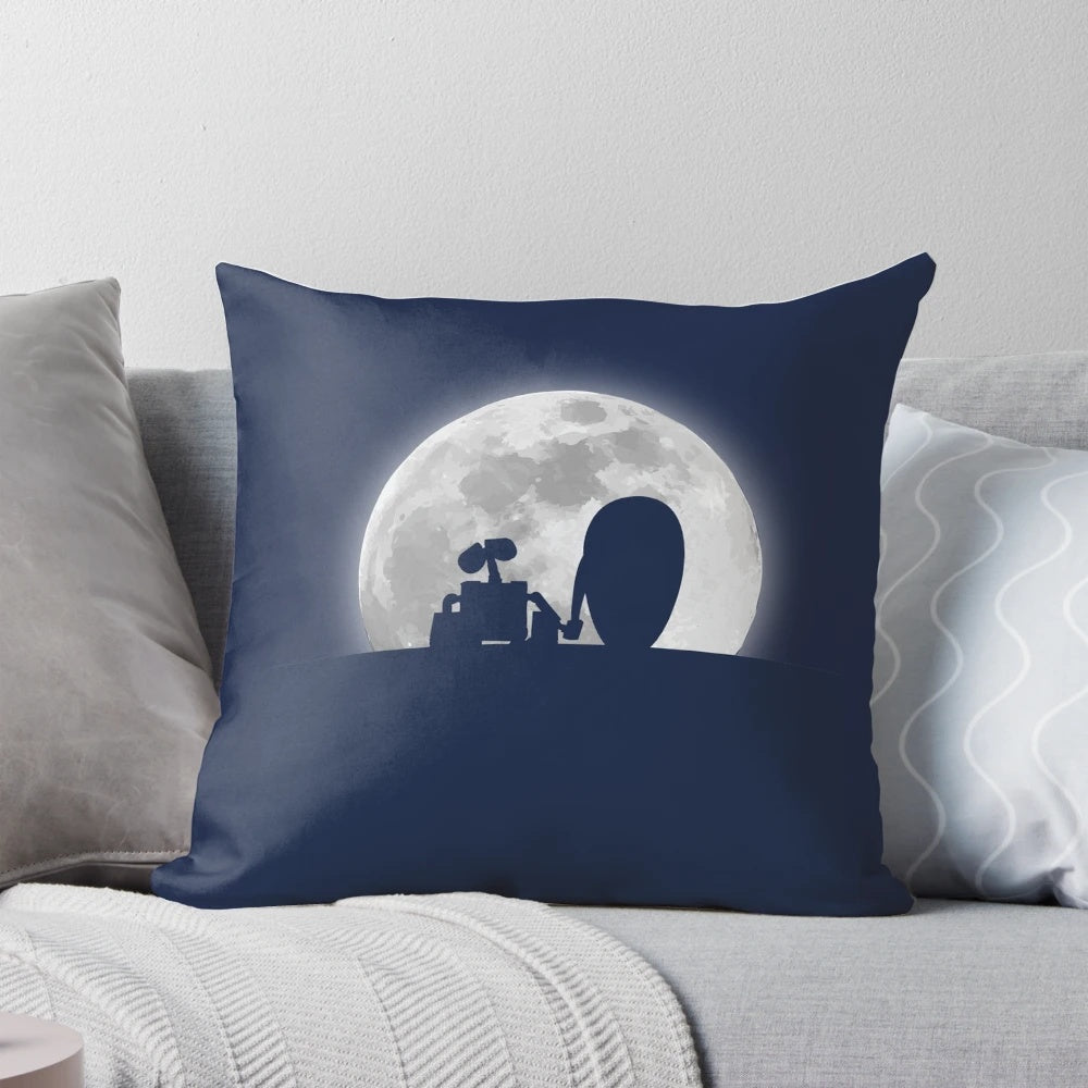 A decorative pillow featuring the silhouettes of the characters Wall•E and EVE from the Pixar film, set against a moonlit backdrop.