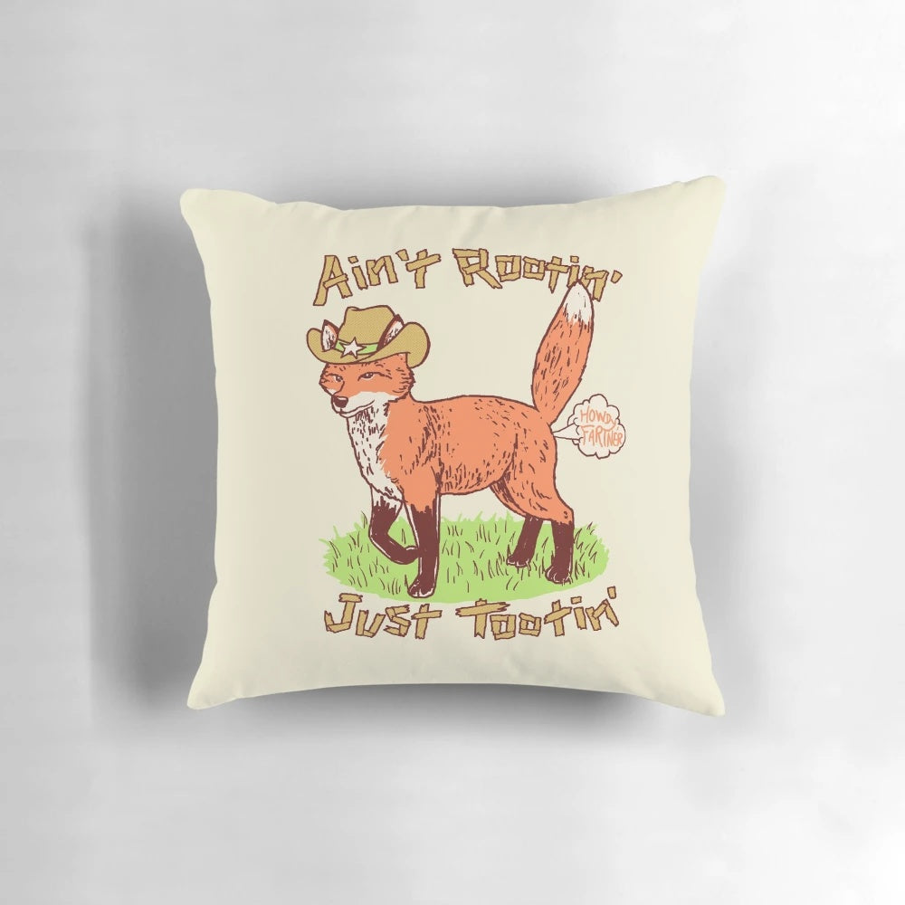 Rustic pillow featuring a fox in cowboy attire, perfect for a wild west-themed room.