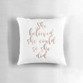 Rose gold foil-printed throw pillow with the motivational quote "She believed she could so she did"