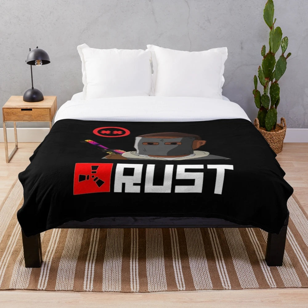 Rust video game-inspired plush blanket featuring the game's distinctive artwork and design